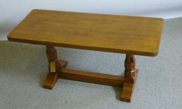 Appraisal: AN ADZED OAK COFFEE TABLE by Robert Mouseman Thompson of