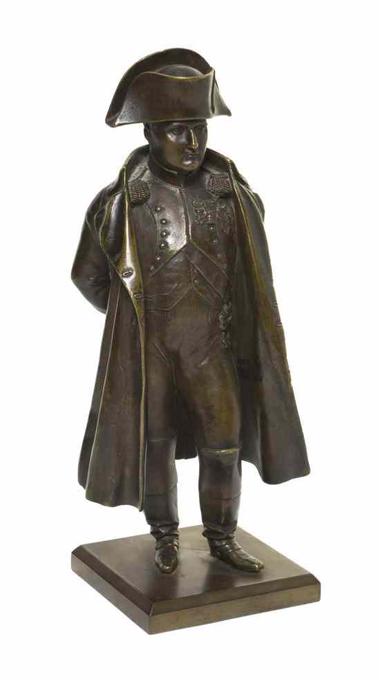 Appraisal: A French Bronze Figure depicting a standing Napoleon with hands