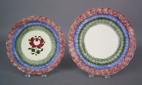 Appraisal: Two red blue and green rainbow spatter plates th c