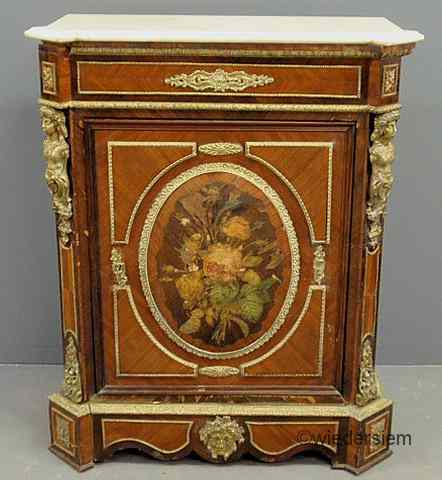 Appraisal: French Empire fruitwood cabinet with a marble top ornate center