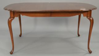 Appraisal: Harden cherry shaped dining table with two leaves and custom