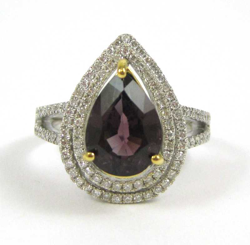 Appraisal: SPINEL DIAMOND AND FOURTEEN KARAT GOLD RING The white and