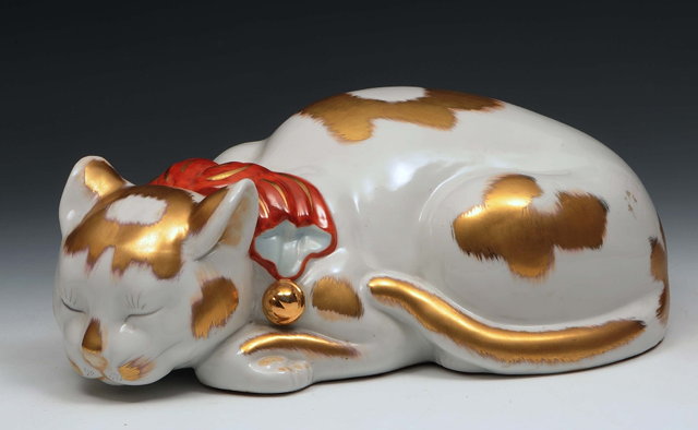 Appraisal: A Japanese Kutani porcelain model of a sleeping catMeiji periodwith