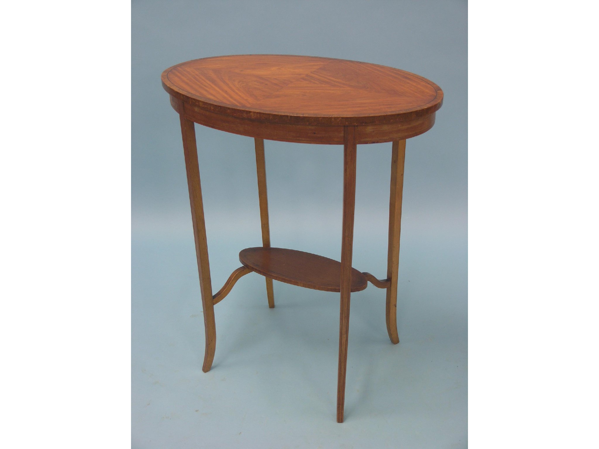 Appraisal: A Sheraton-style satinwood occasional table oval quarter-veneered top with undertier