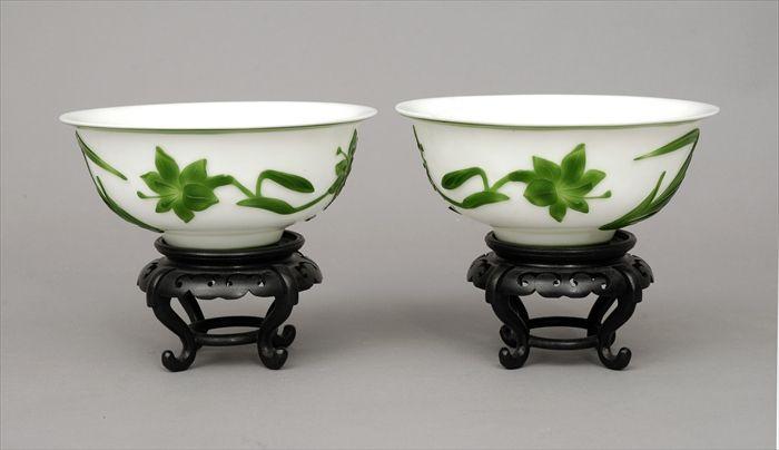 Appraisal: Pair of Peking Green Overlay Glass Bowls with Stands in