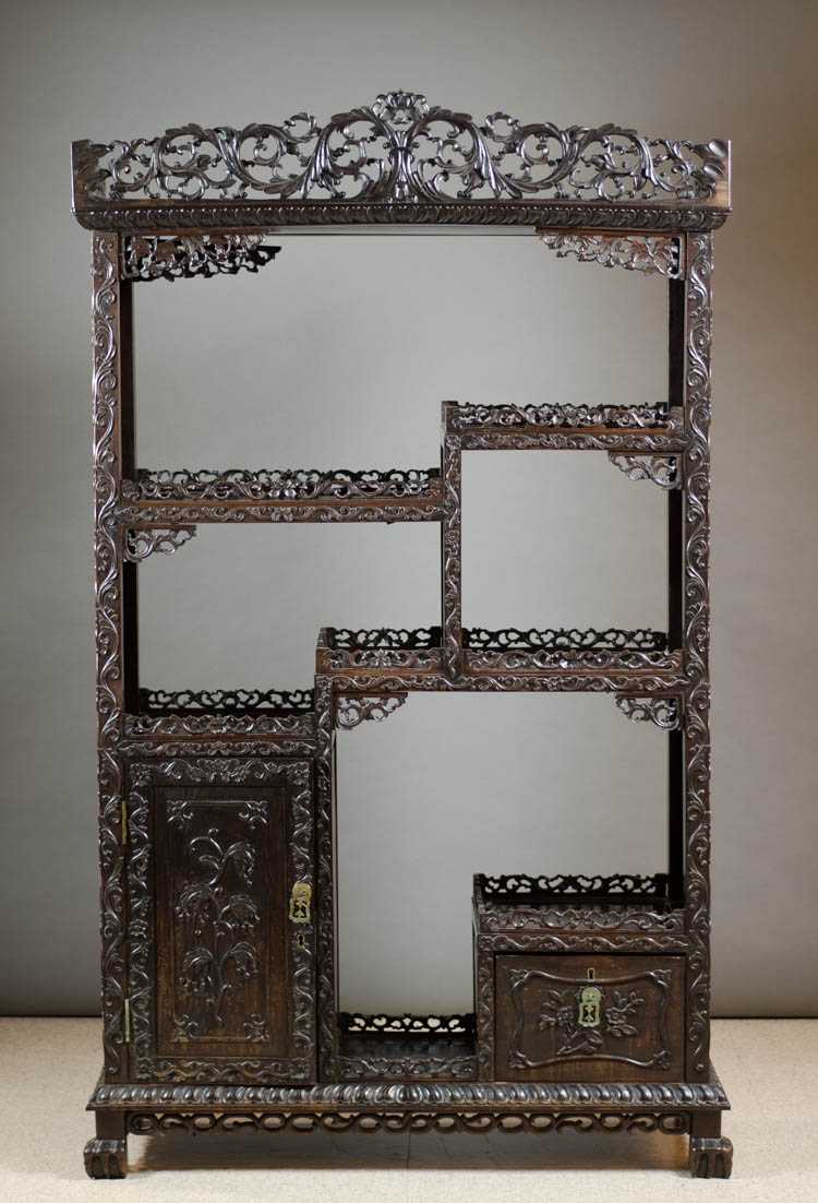 Appraisal: CARVED ROSEWOOD ETAGERE Chinese early th century having six levels