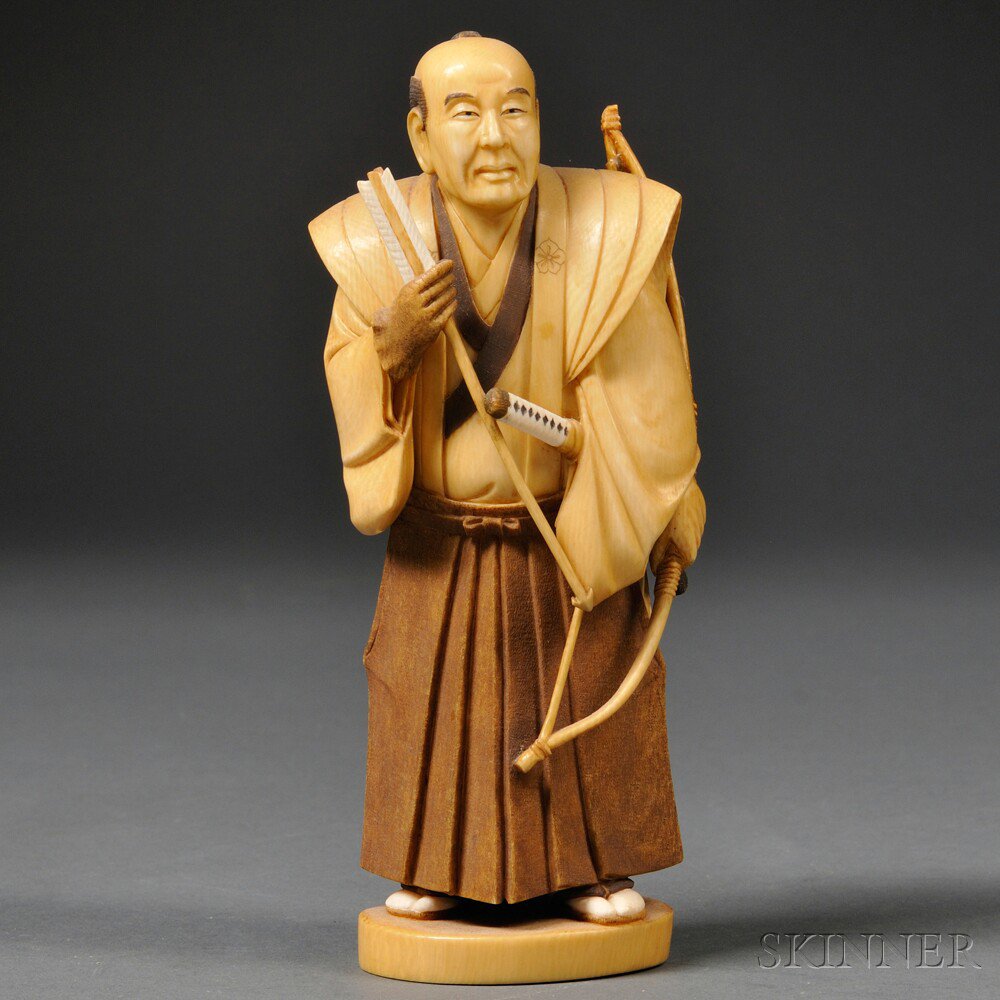 Appraisal: Ivory Carving of a Samurai Japan th th century holding