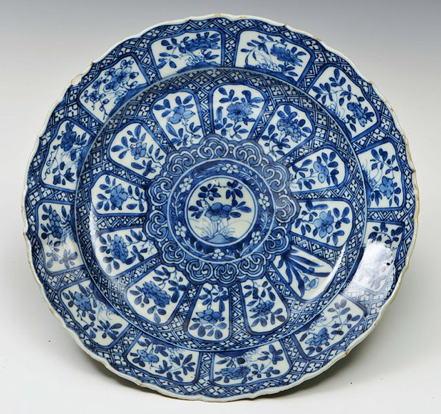 Appraisal: A CHINESE BLUE AND WHITE PANELLED DISH the central concentric