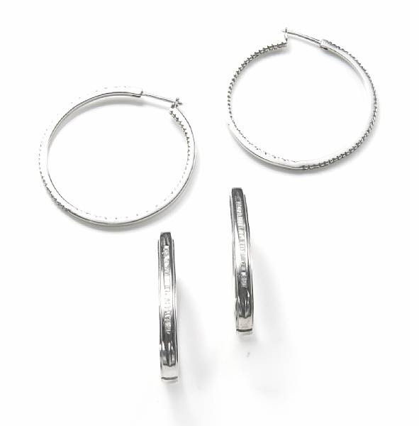 Appraisal: A pair of two diamond and white gold ear hoops