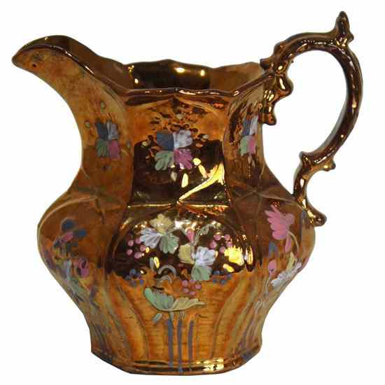 Appraisal: An English Copper Lustre Pitcher circa having a beak spout