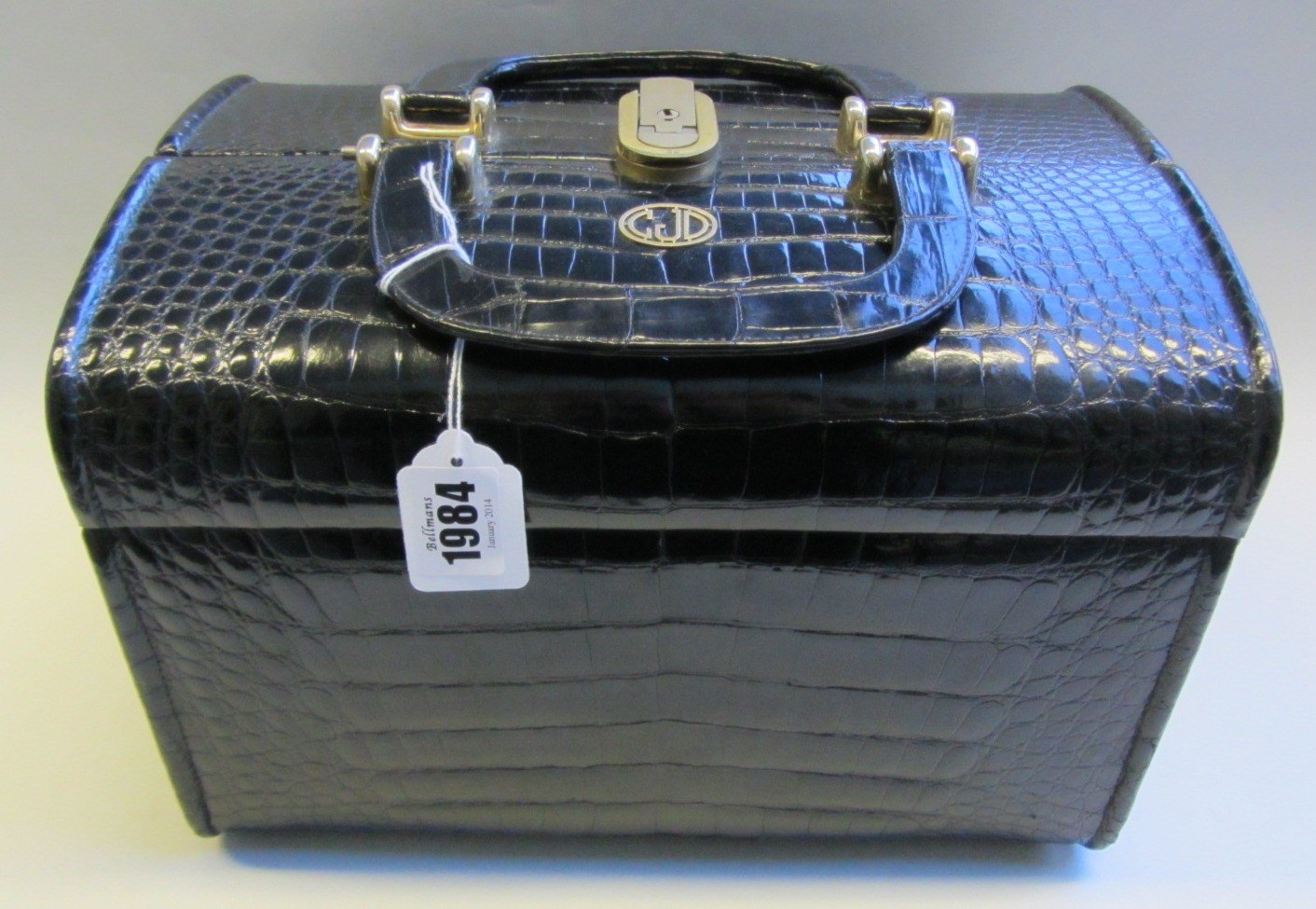 Appraisal: A black leather crocodile skin vanity case th Century with