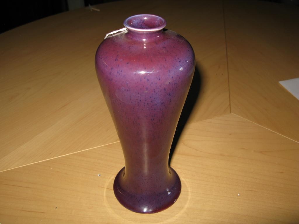 Appraisal: A Moorcroft baluster jar glazed in a deep lilac impressed