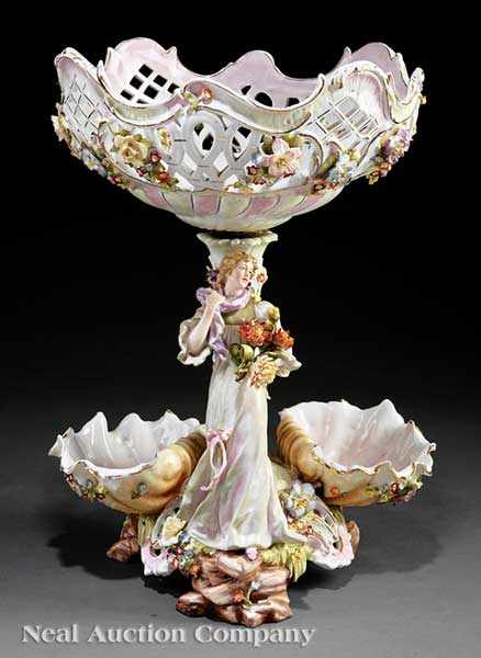 Appraisal: A Large German Porcelain Polychrome and Gilt Figural Centerpiece underglaze