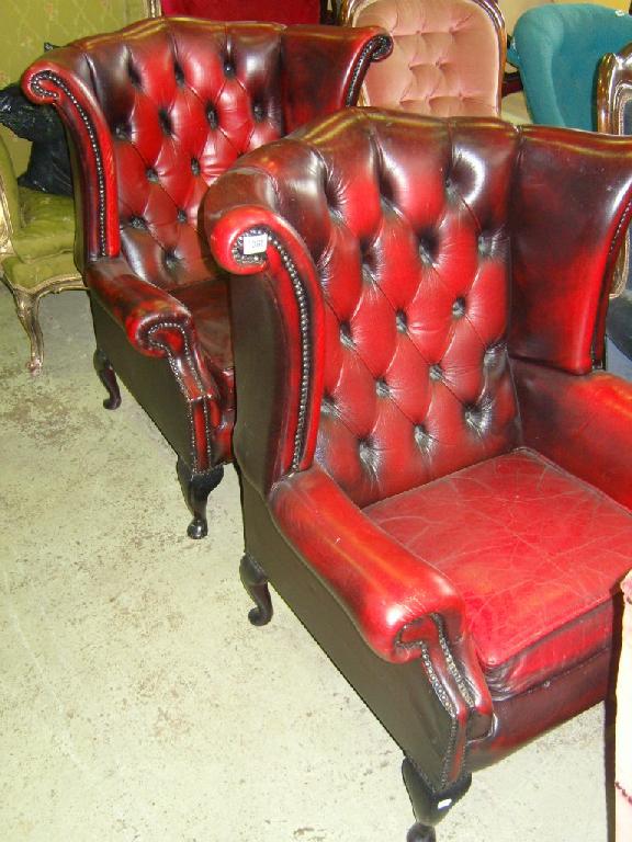 Appraisal: A pair of Georgian style library chairs upholstered in simulated