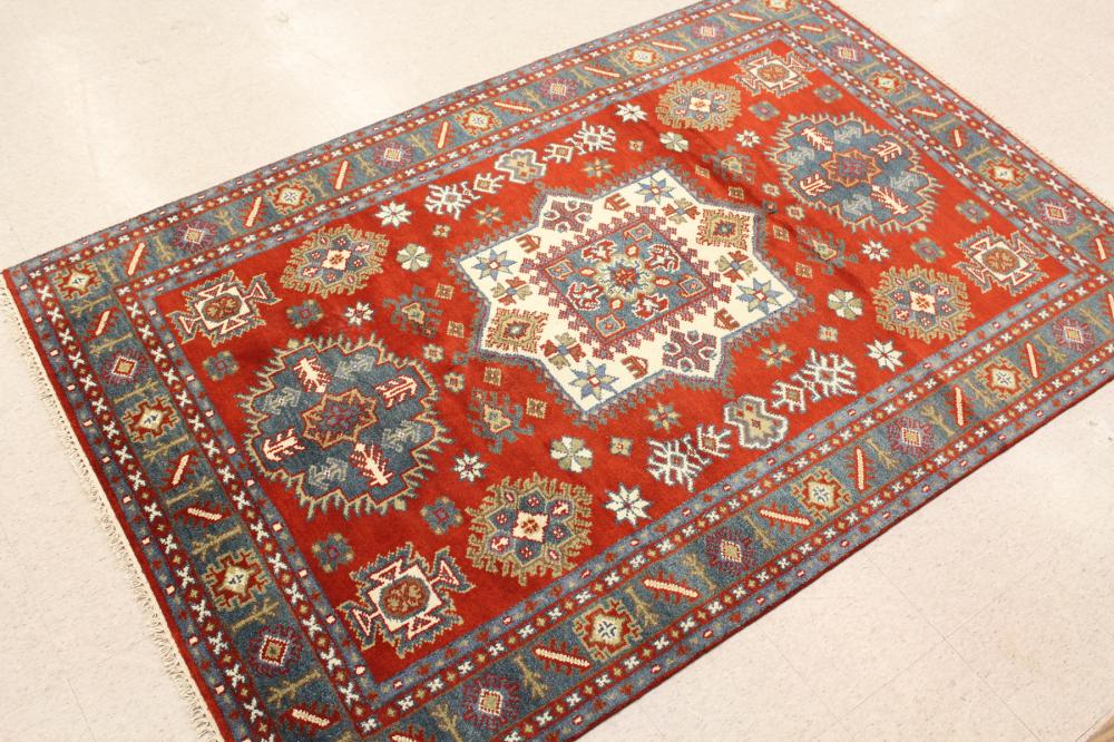 Appraisal: HAND KNOTTED ORIENTAL CARPET Indo-Caucasian overall geometric and curvilinear tribal