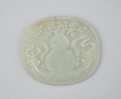 Appraisal: Carved Jade Disc Carved in a celadon color jade the