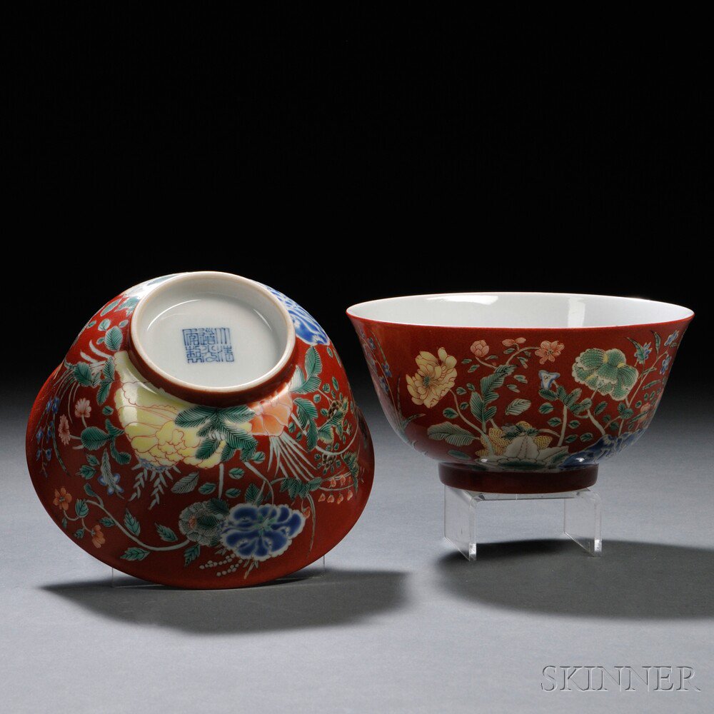 Appraisal: Pair of Red-ground Porcelain Bowls China the exterior painted with