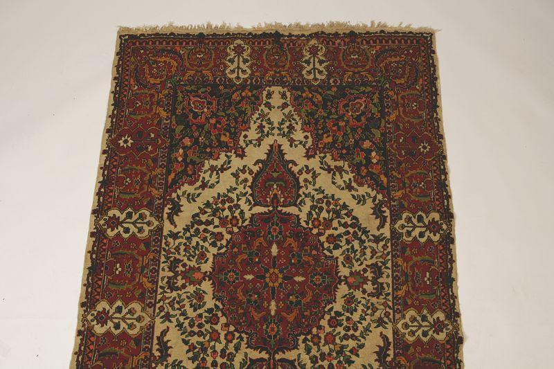 Appraisal: A PERSIAN RUG OF ISFAHAN TYPE the brick red ground