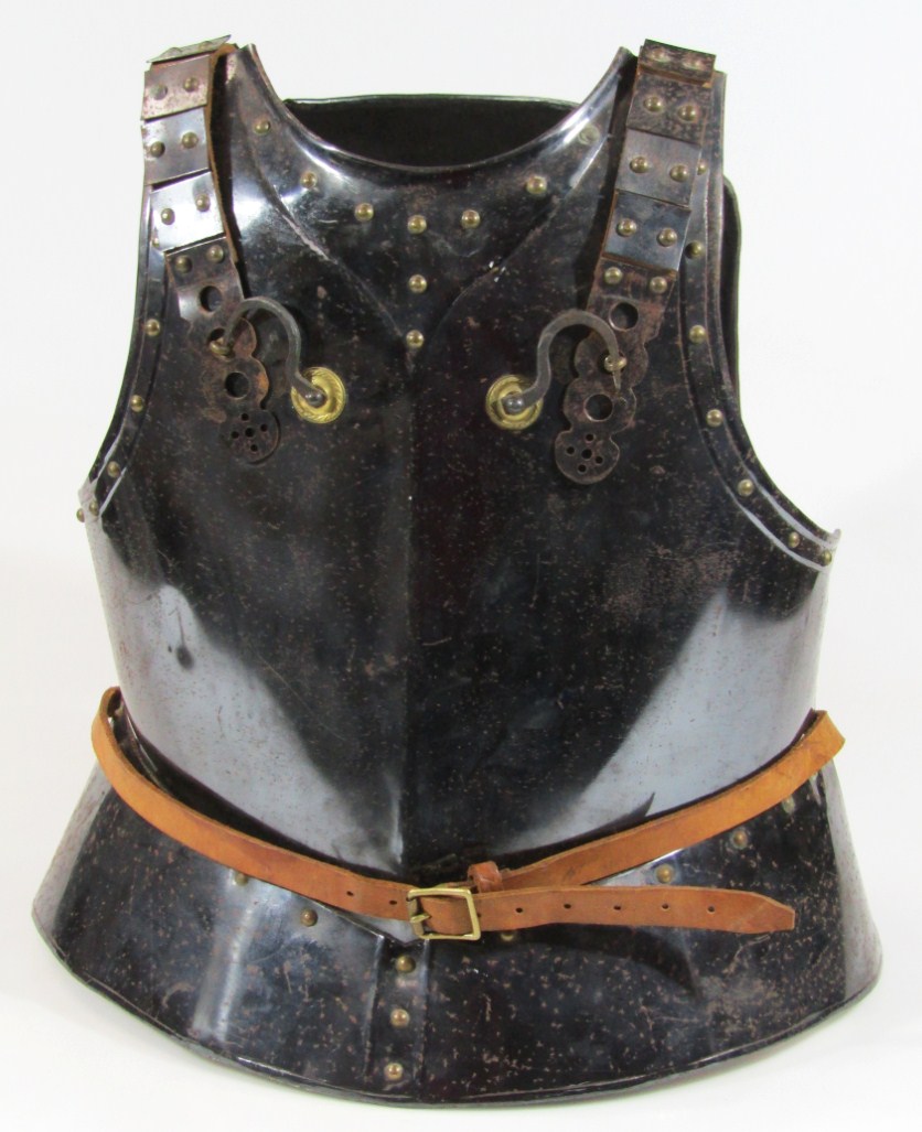 Appraisal: A Cromwellian style armour breast plate with shaped shoulder sections