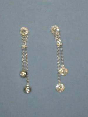 Appraisal: A PAIR OF DIAMOND EARRINGS comprising a diamond cluster supporting