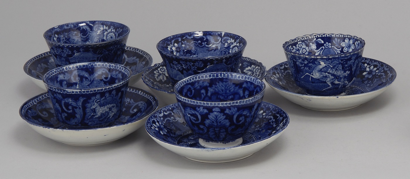 Appraisal: FIVE ENGLISH STAFFORDSHIRE CUPS AND SAUCERS th CenturyIn dark blue