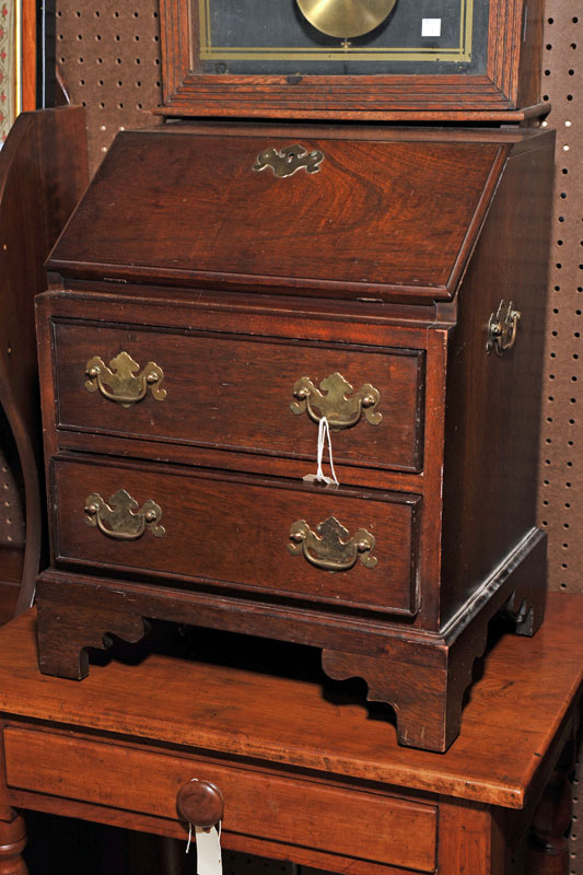 Appraisal: MINIATURE SLANT LID DESK Walnut and of typical form with