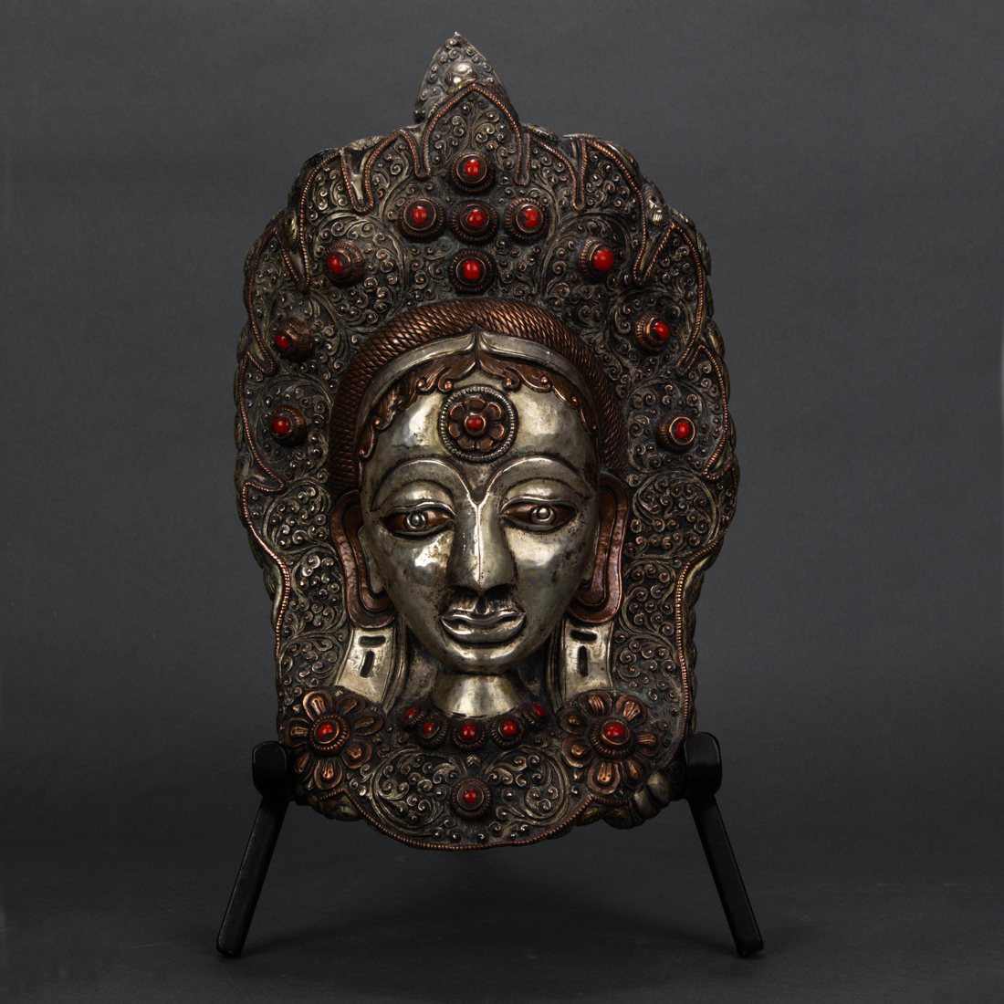 Appraisal: HIMALAYAN SILVERED COPPER HEAD OF TARA DEVA Himalayan silvered copper