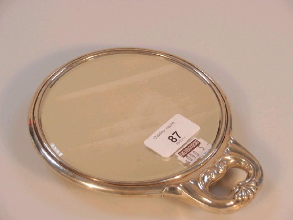 Appraisal: An Edwardian silver backed hand mirror embossed with angels Chester