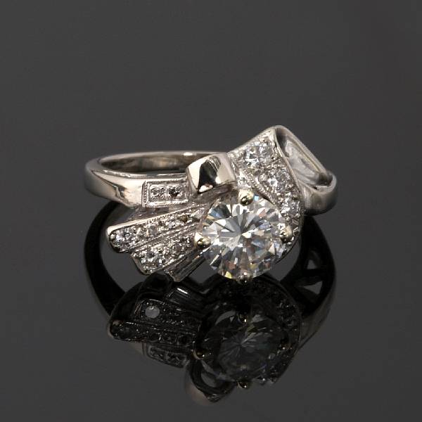 Appraisal: A diamond ring central diamond weighing an estimated carats mounted