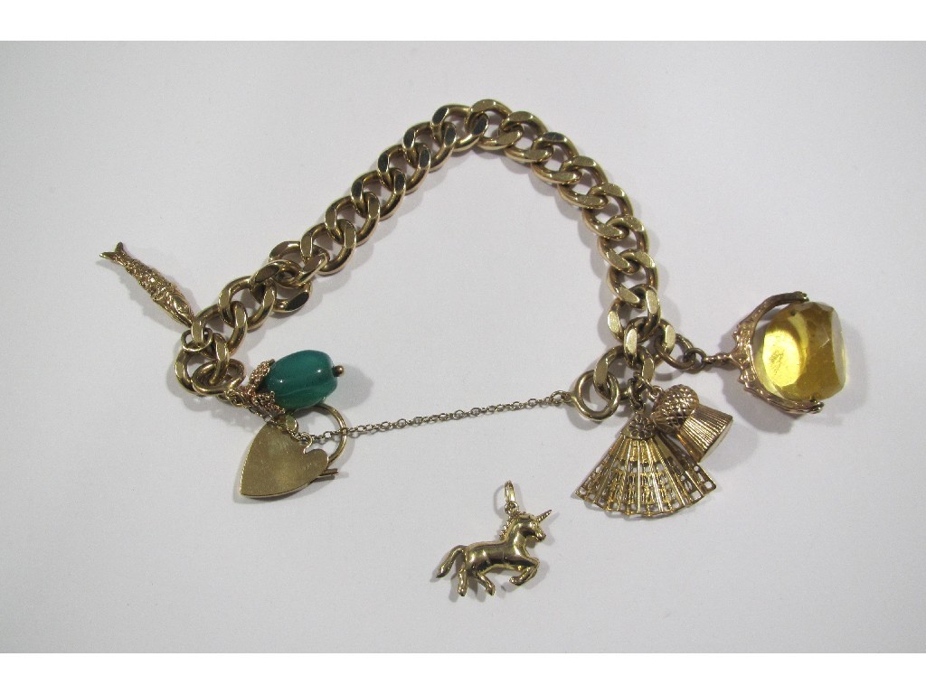 Appraisal: Nine carat gold charm bracelet six various gold charms to