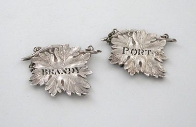 Appraisal: A pair of Victorian silver vine leaf wine labels pierced