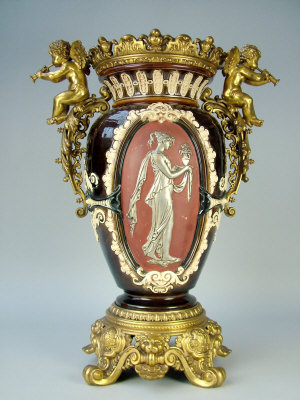 Appraisal: A th century moulded pottery lamp base decorated with two