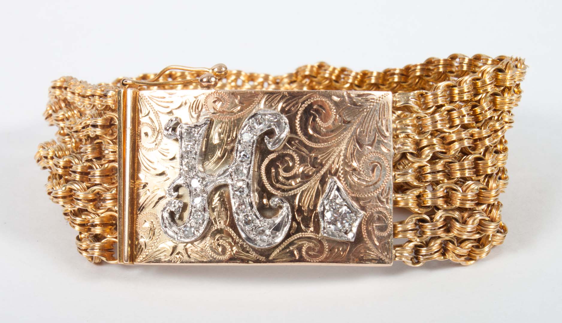 Appraisal: K gold chain link cuff bracelet with diamond H in