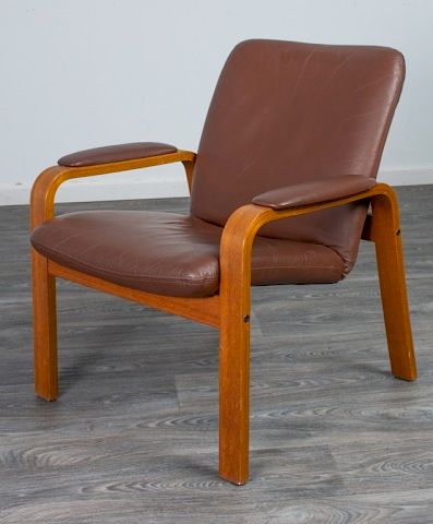 Appraisal: Ekornes Style Leather and Oak Lounge Chair Lounge chair with