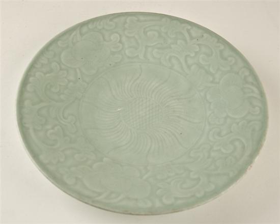 Appraisal: A Chinese Celadon Charger with Floral Relief Design possibly Ming