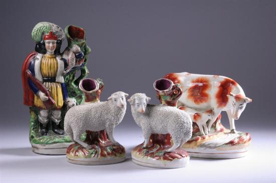 Appraisal: FOUR STAFFORDSHIRE POTTERY FIGURES th century Pair sheep spill vases