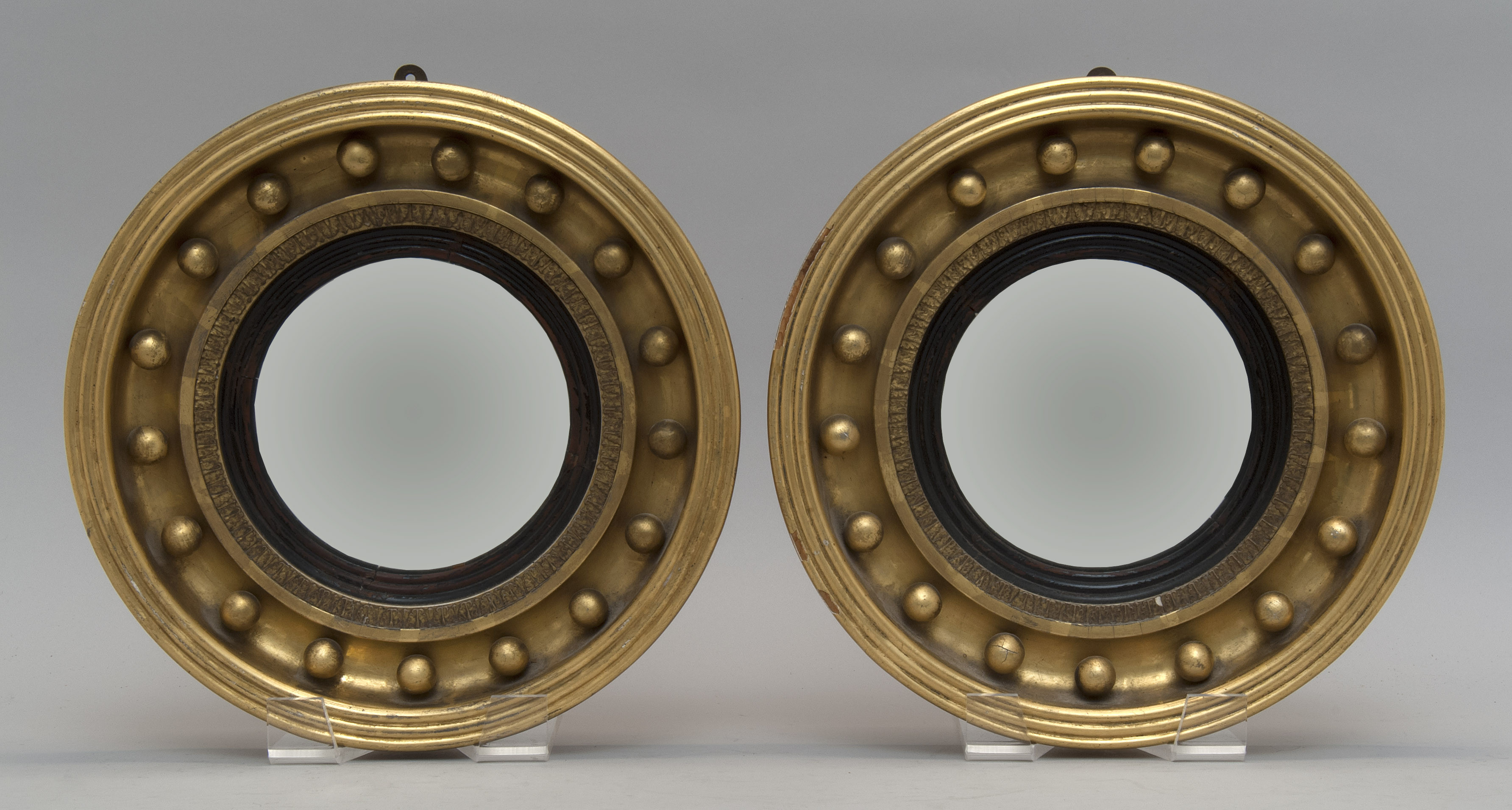 Appraisal: PAIR OF GILT BULL'S-EYE MIRRORS Early th CenturyDiameters overall ConditionSome