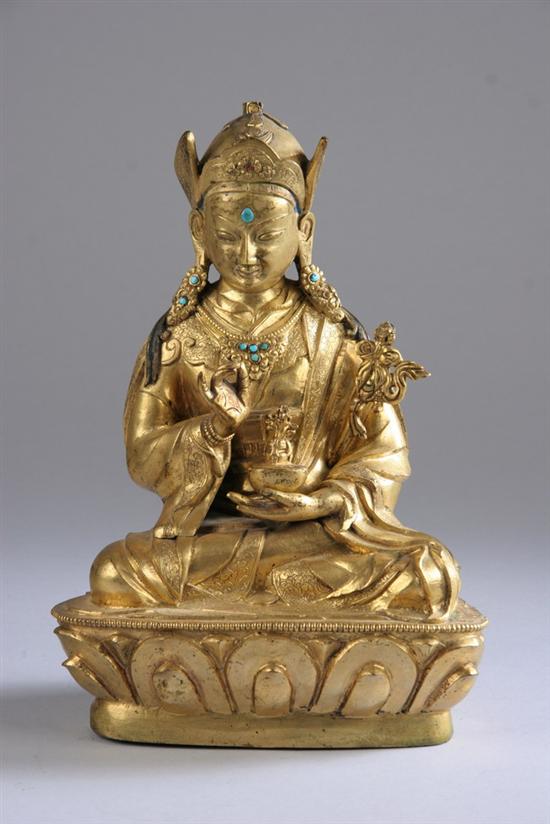 Appraisal: SINO-TIBETAN GILT BRONZE FIGURE OF MONK th century Seated on