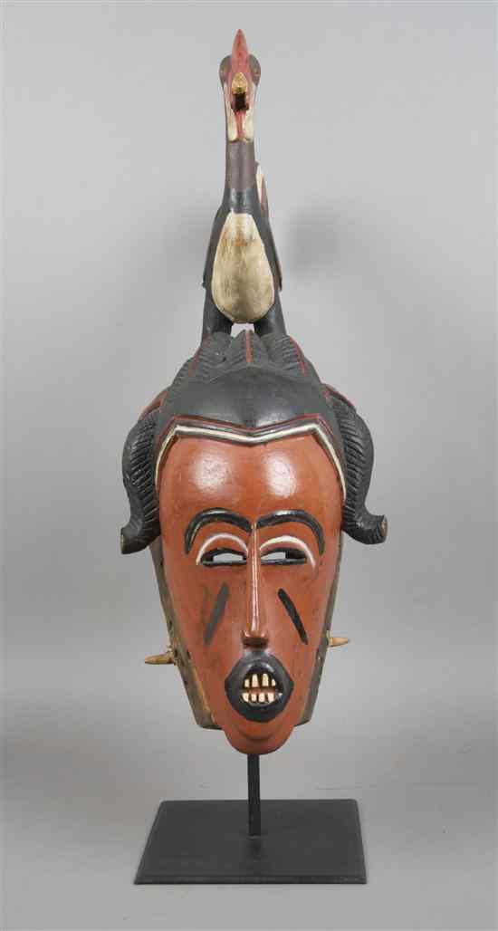 Appraisal: A Carved and Polychrome Decorated Mask Yaure the elongated face