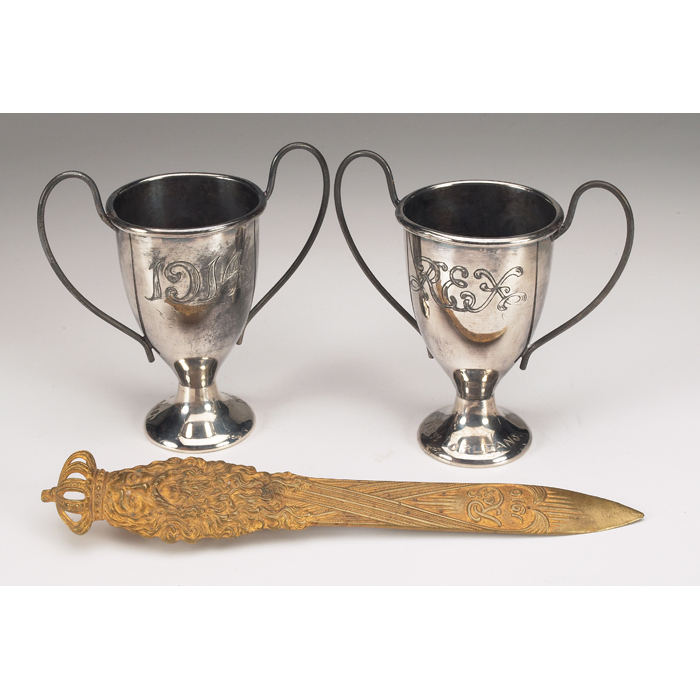 Appraisal: Early Mardi Gras souvenirs letter opener and two trophy cups