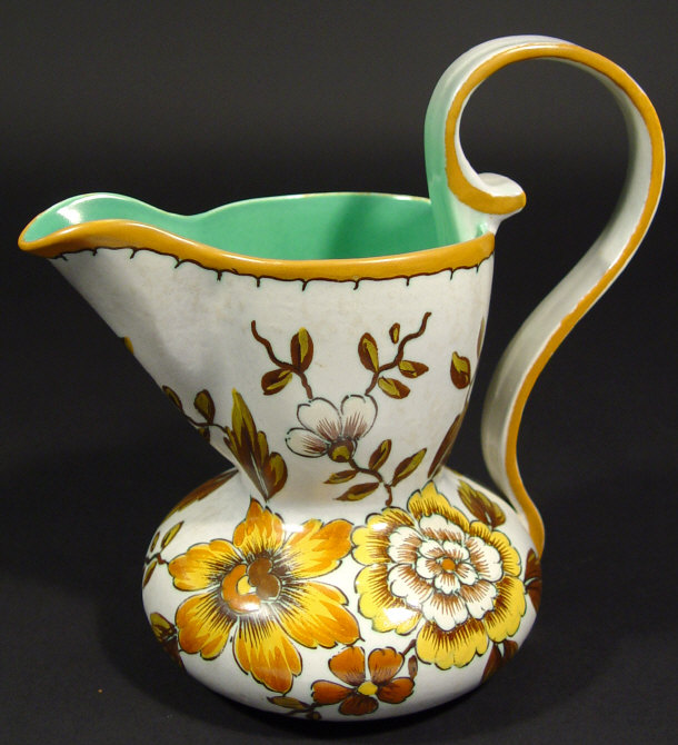 Appraisal: Gouda pottery jug hand painted with flowers onto a grey