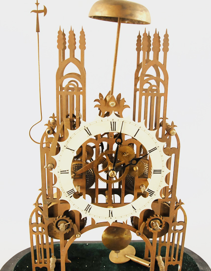 Appraisal: A Gothic Chain Fusee Skeleton Clock brass with enameled chapter