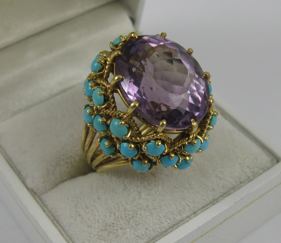 Appraisal: AMETHYST TURQUOISE AND K GOLD RING Centered and prong set