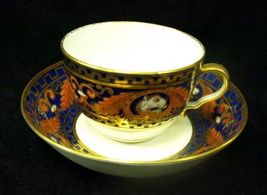 Appraisal: A spode teacup and saucer decorated lions masks within gilt