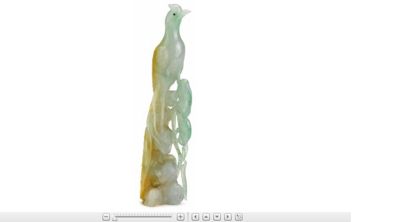 Appraisal: Fine Chinese carved apple green and mottled jadeite carvingCarved to