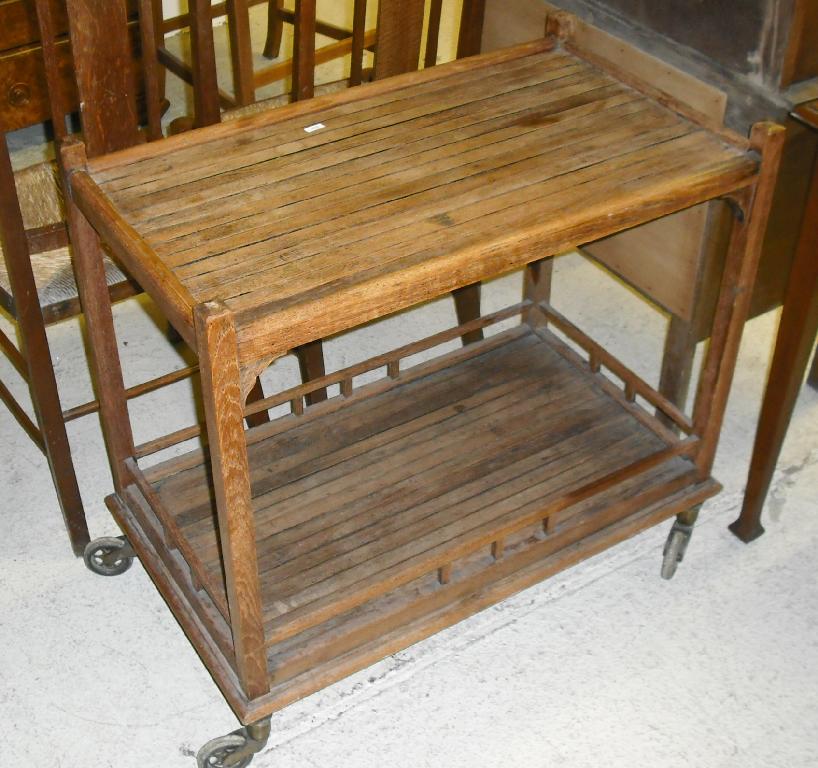 Appraisal: Teak slatted two tier serving trolley wide