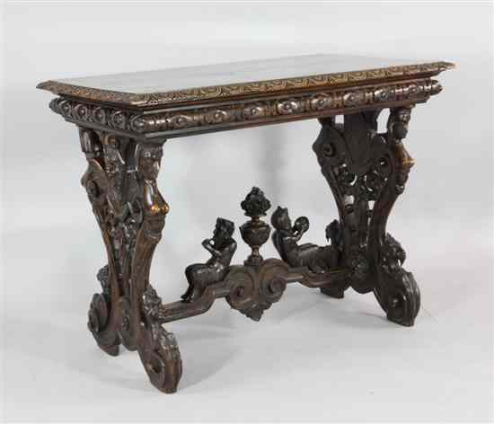 Appraisal: A th century design carved and stained beech side table