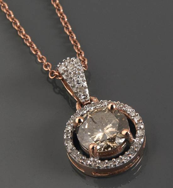 Appraisal: A diamond and k rose gold pendant with chain central