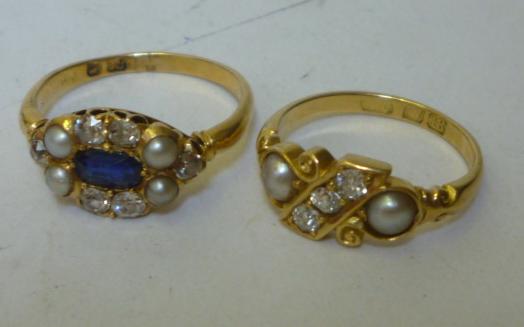 Appraisal: A VICTORIAN DIAMOND AND HALF PEARL RING having a panel