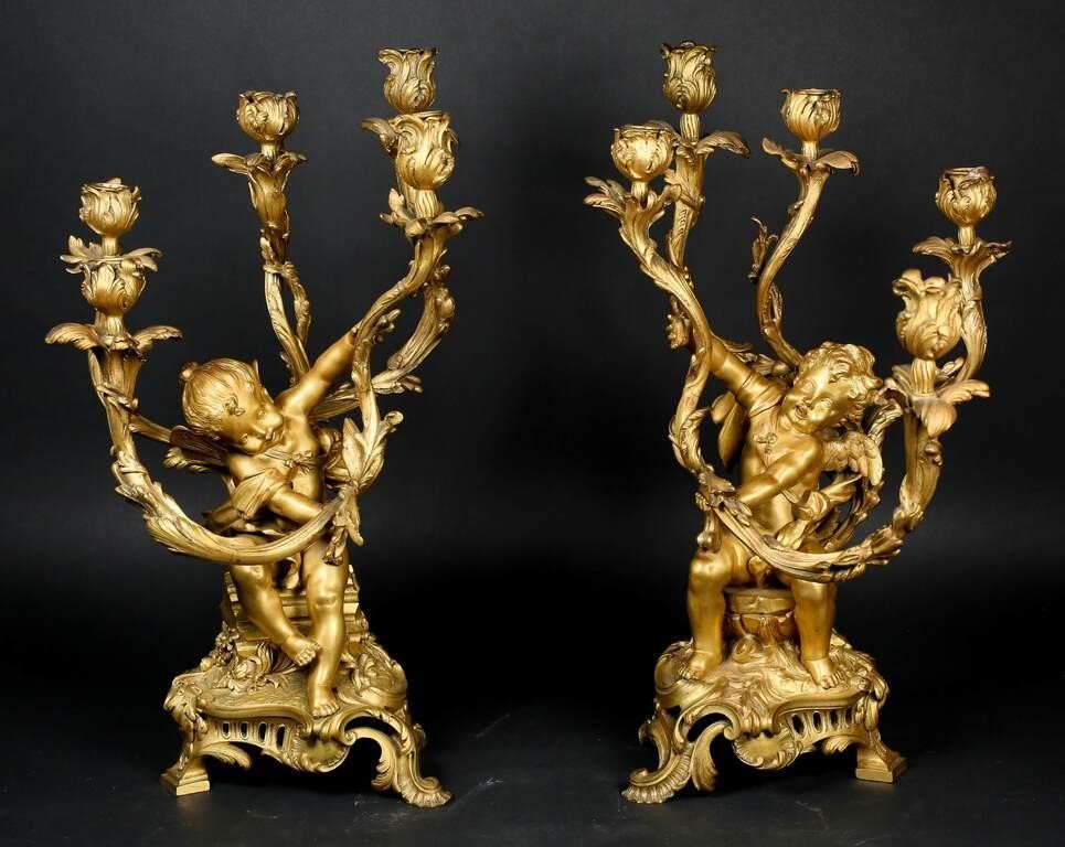 Appraisal: Pair of French gilt bronze light figural candelabra with winged